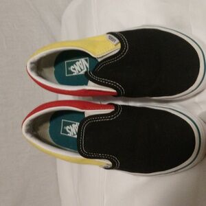 Red and yellow and black slip on vans